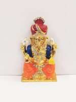 Image of a Car dashboard idol of Ganesha wearing a Pagdi