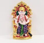 Image of a Car dashboard Idol of Ganesha sitting on a throne