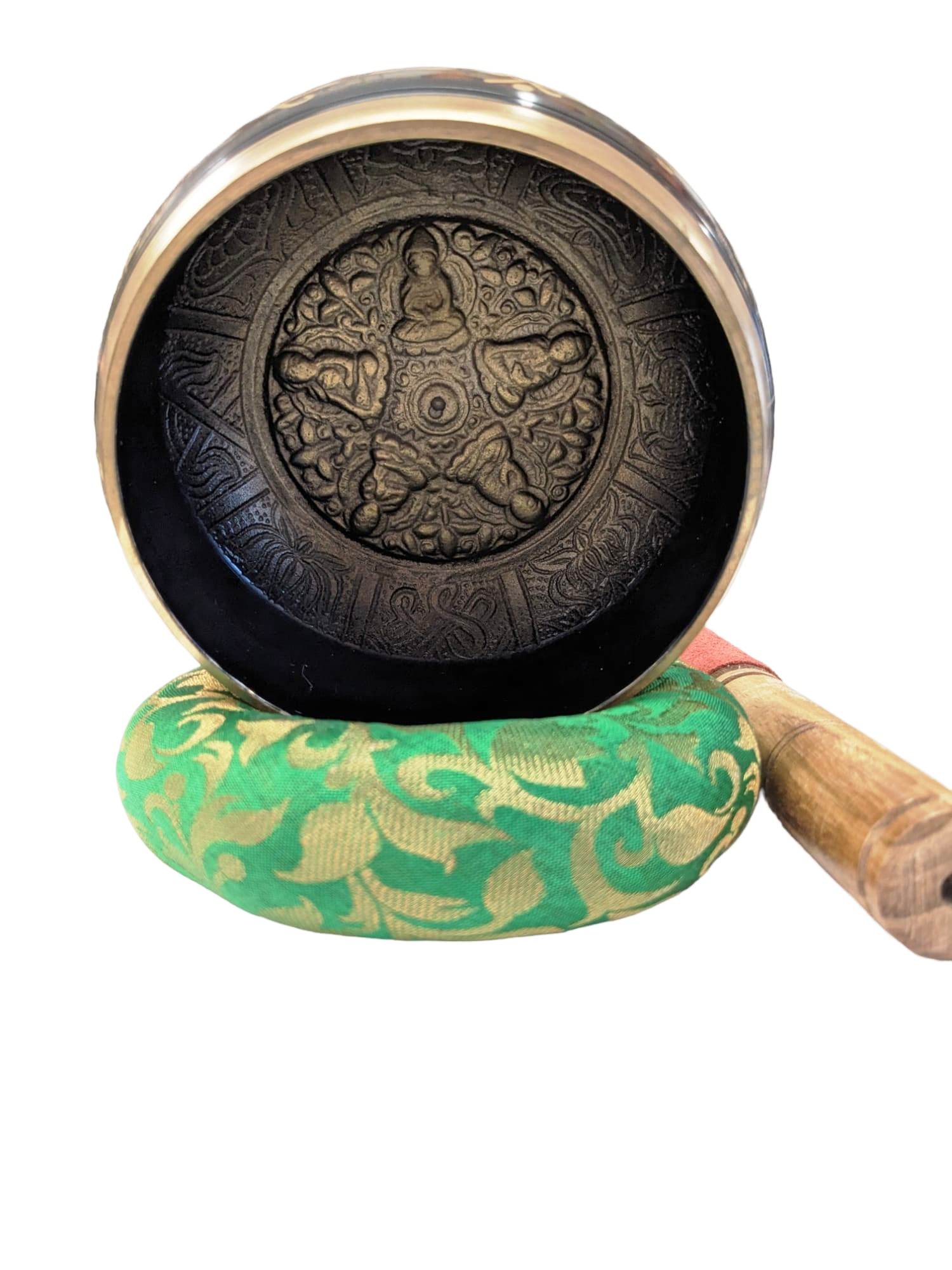Image of a 5 inches Tibetan Singing bowl with a wooden mallet placed on a Cushion Cover