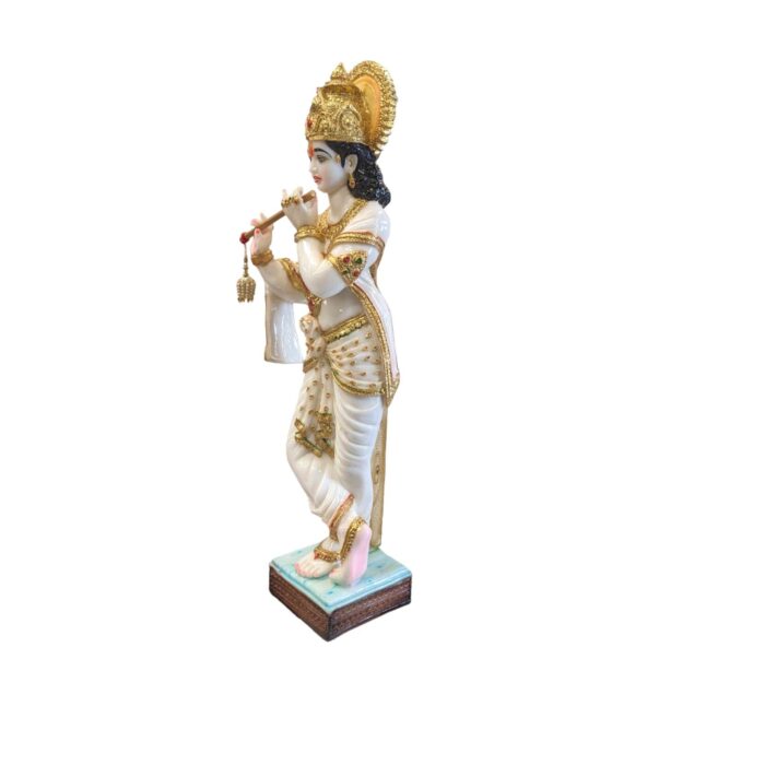 Another side view of Krishna Statue with Gold hues on this white marble dust piece