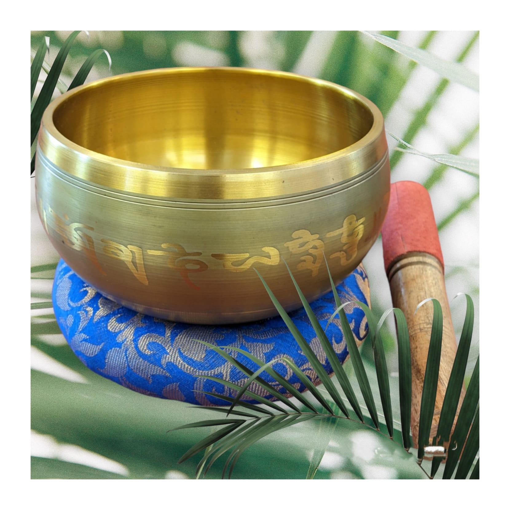 Image of a 6 inch Tibetan Singing bowl with a wooden mallet placed on a Cushion Cover