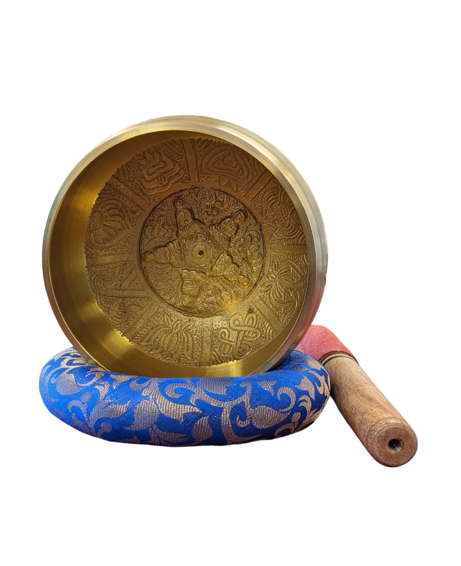Image of a 6 inch Tibetan Singing bowl with a wooden mallet placed on a Cushion Cover