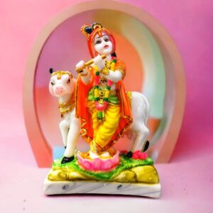 Image of Krishna statue playing flute with a cow