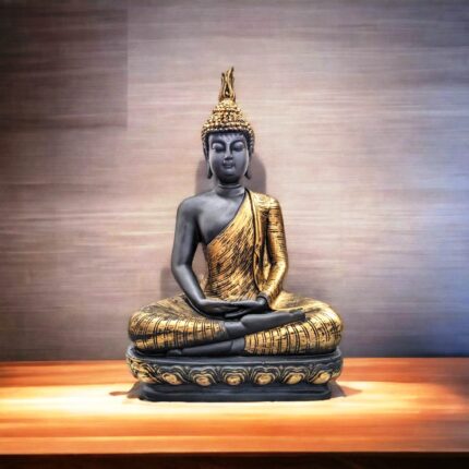 Image of a meditating Buddha Idol placed on a wooden platform under warm lighting in a yoga room