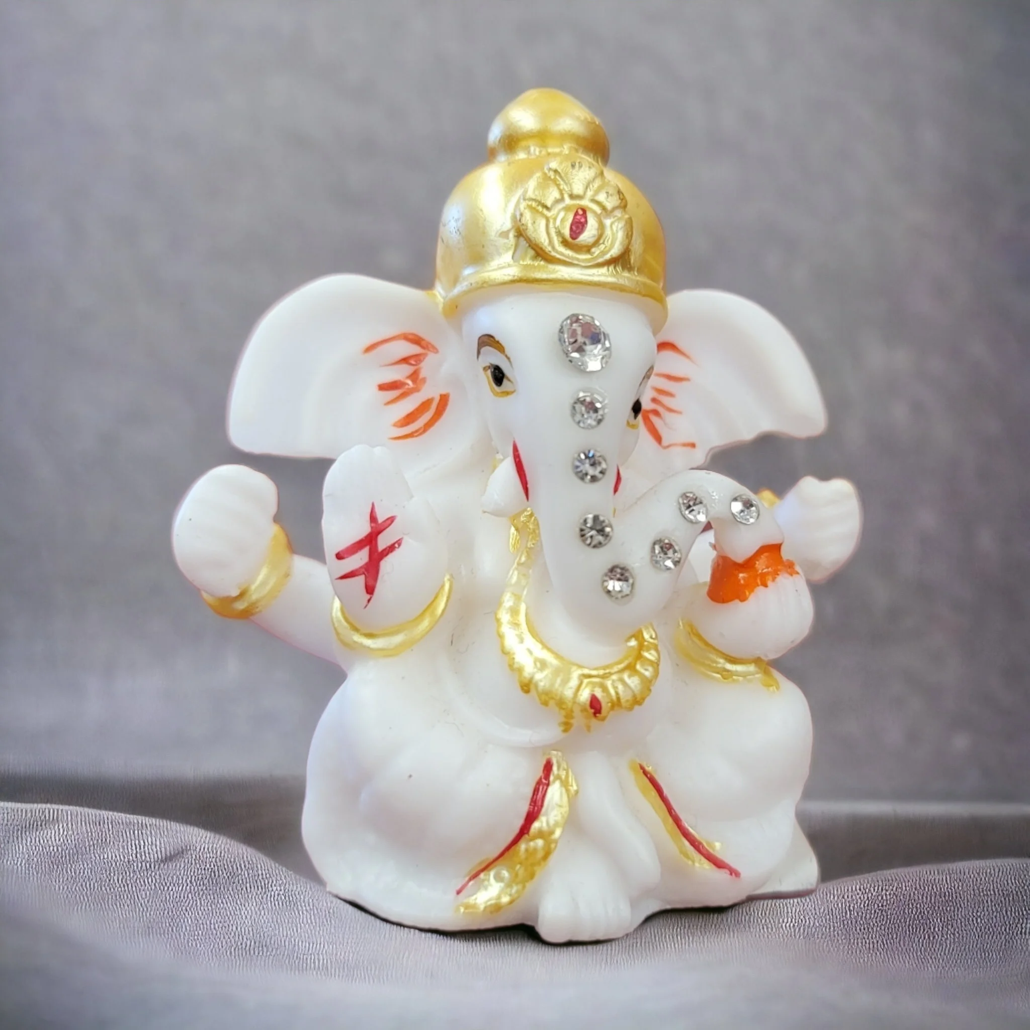 side view Image of a premium Ganesha car dashboard idol - 6004. Ships in Canada and the US only.