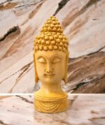 Image of a hand carved buddha face statue which is available in Canada and US