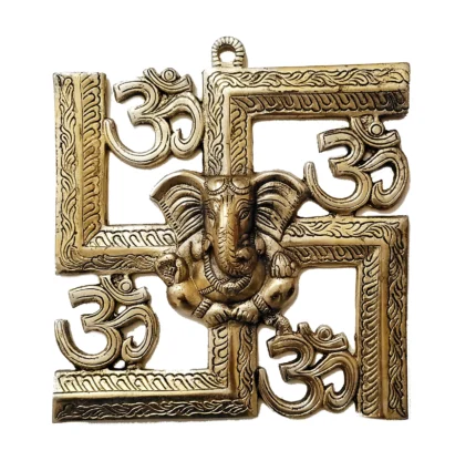 Image of a wall hanging of auspicious swastik with Ganesha and om brass hanging