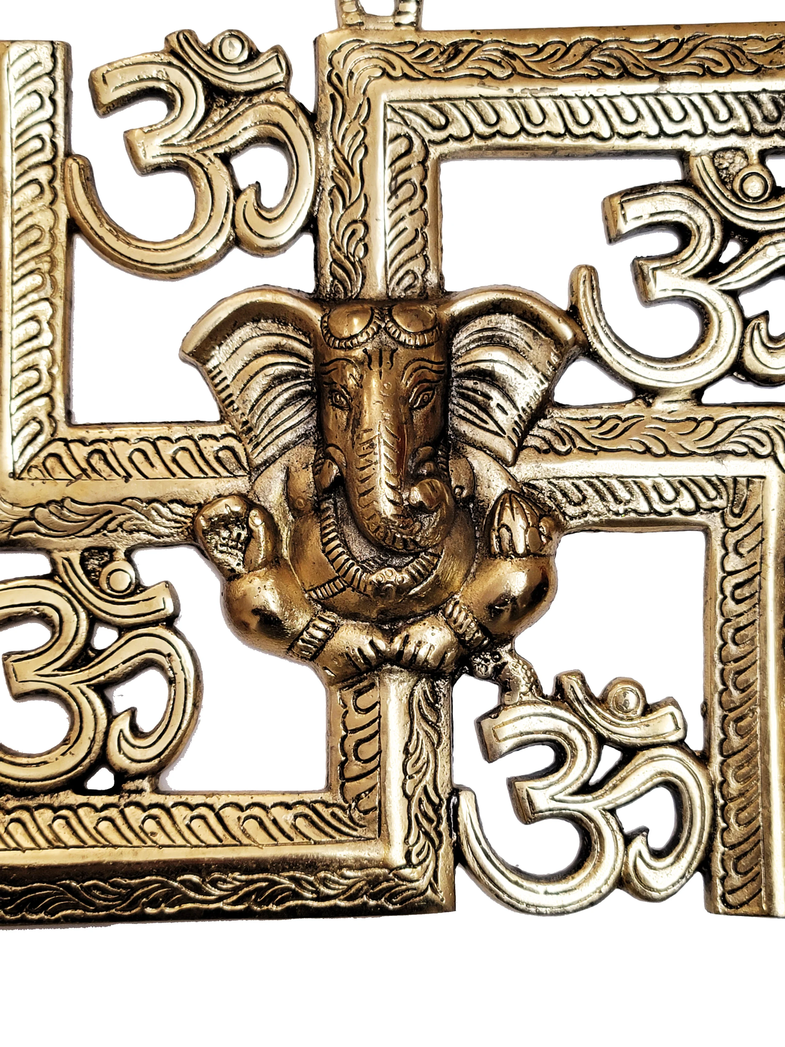 Image of a wall hanging of auspicious swastik with Ganesh and om brass hanging