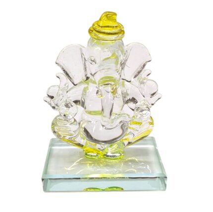 Image of a yellow crystal Ganesh car dashboard Idol