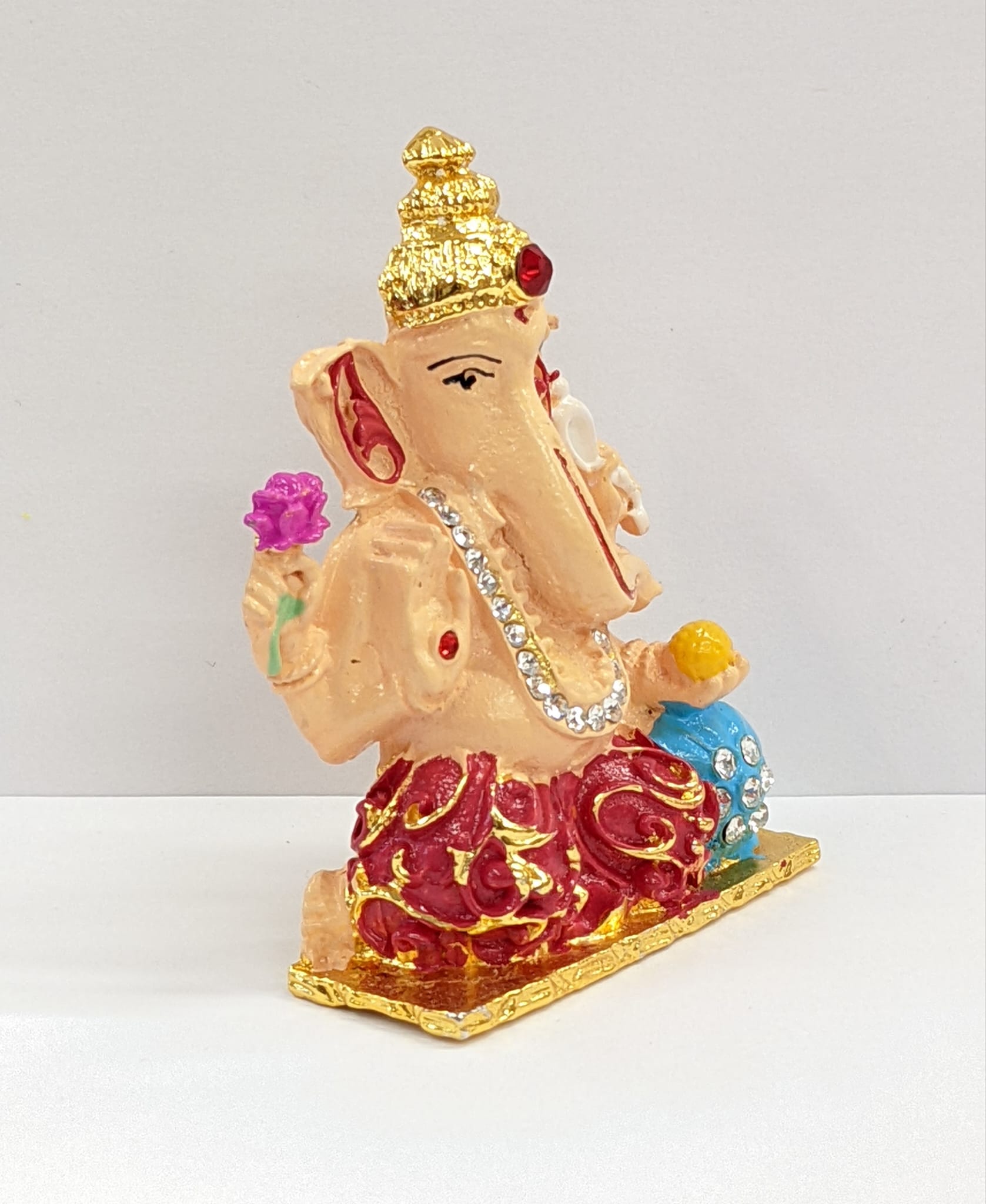 Other side view Image of a multi color Ganesha Car dashboard Statue