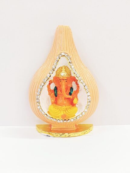 Car Dashboard Idol of Ganesha sitting inside a shell