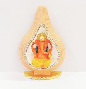 Car Dashboard Idol of Ganesha sitting inside a shell