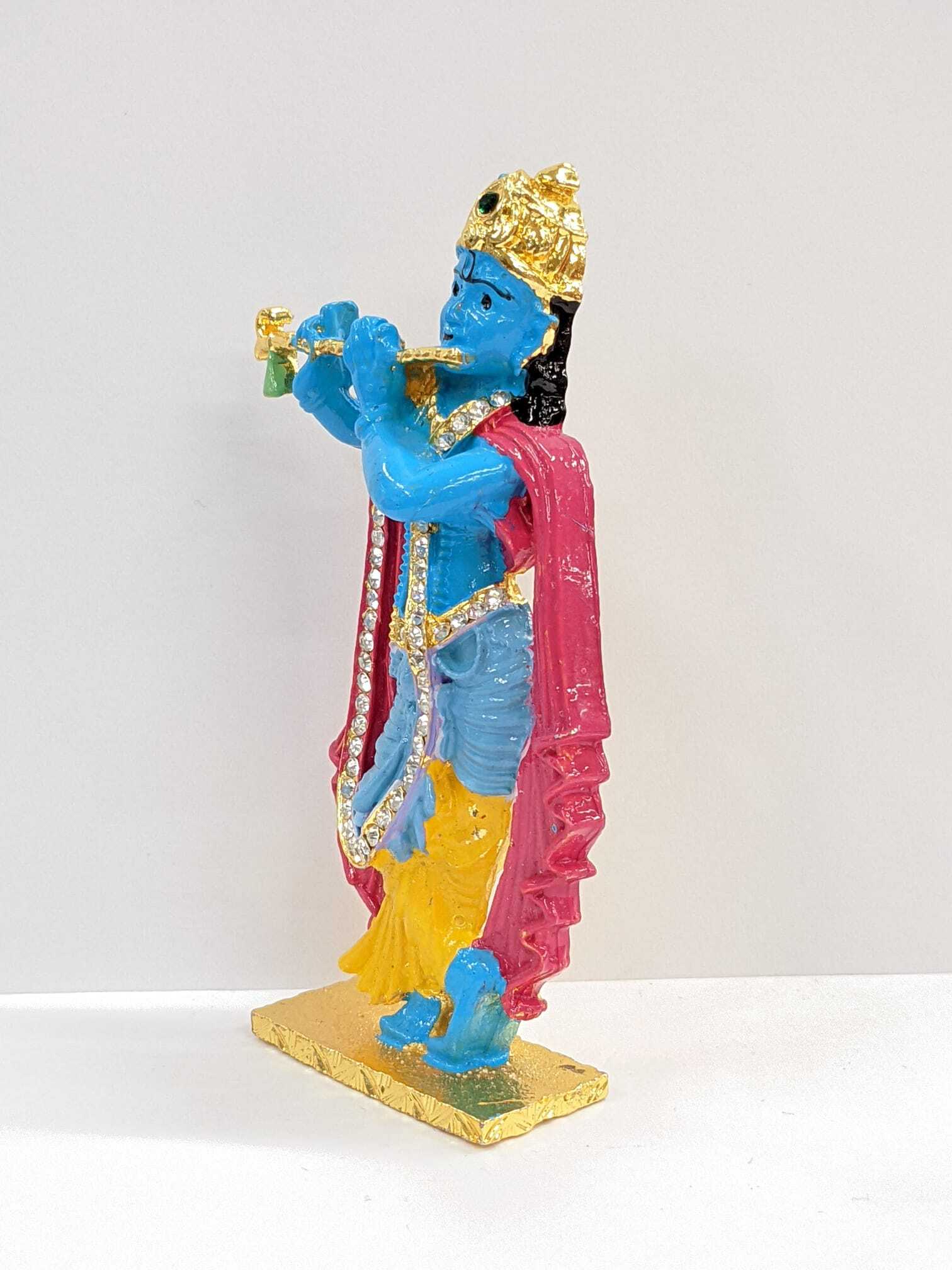 side view image of krishna playing flute car dashboard idol in canada and the US