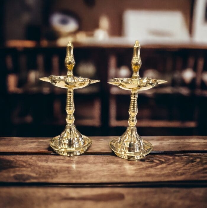 Pair of small Brass Kerala Lamps available for sale in Canada and the US.