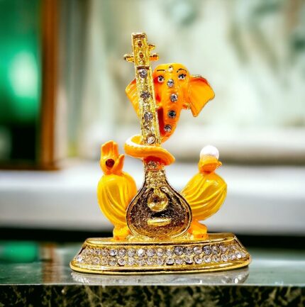 Image of Ganesha Car dashboard Idol holding a veena - orange