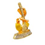 Image of Ganesha Car dashboard Idol holding a veena - orange