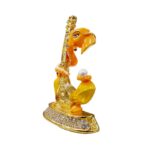 Image of Ganesha Car dashboard Idol holding a veena - orange