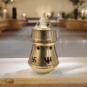Brass Aroma Oil and Camphor Diffuser placed on a platform