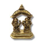 Image of a Brass Lakshmi and Ganesh Idol placed on a platform in a Home Mandir