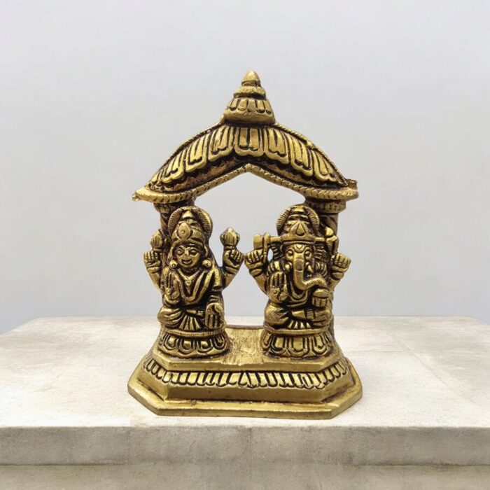 Image of a Brass Lakshmi Ganesh Idol placed on a platform in a Home Mandir