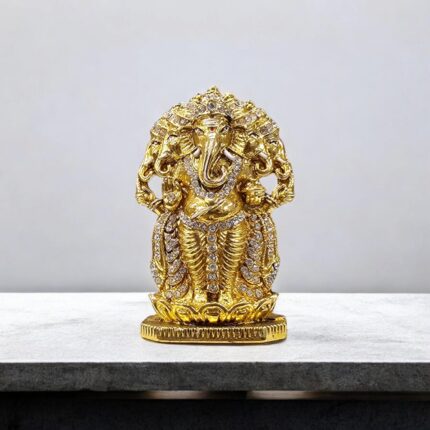 Image of Panchmukhi (five-headed) Ganesh murti. Golden oxidized car dashboard idol