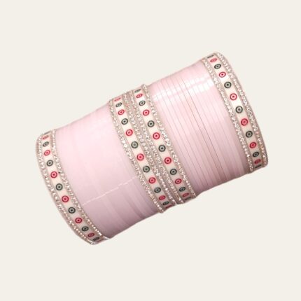 Litchi/Pale Pink colored Chura with silver gemstones on a pink embroidered background.