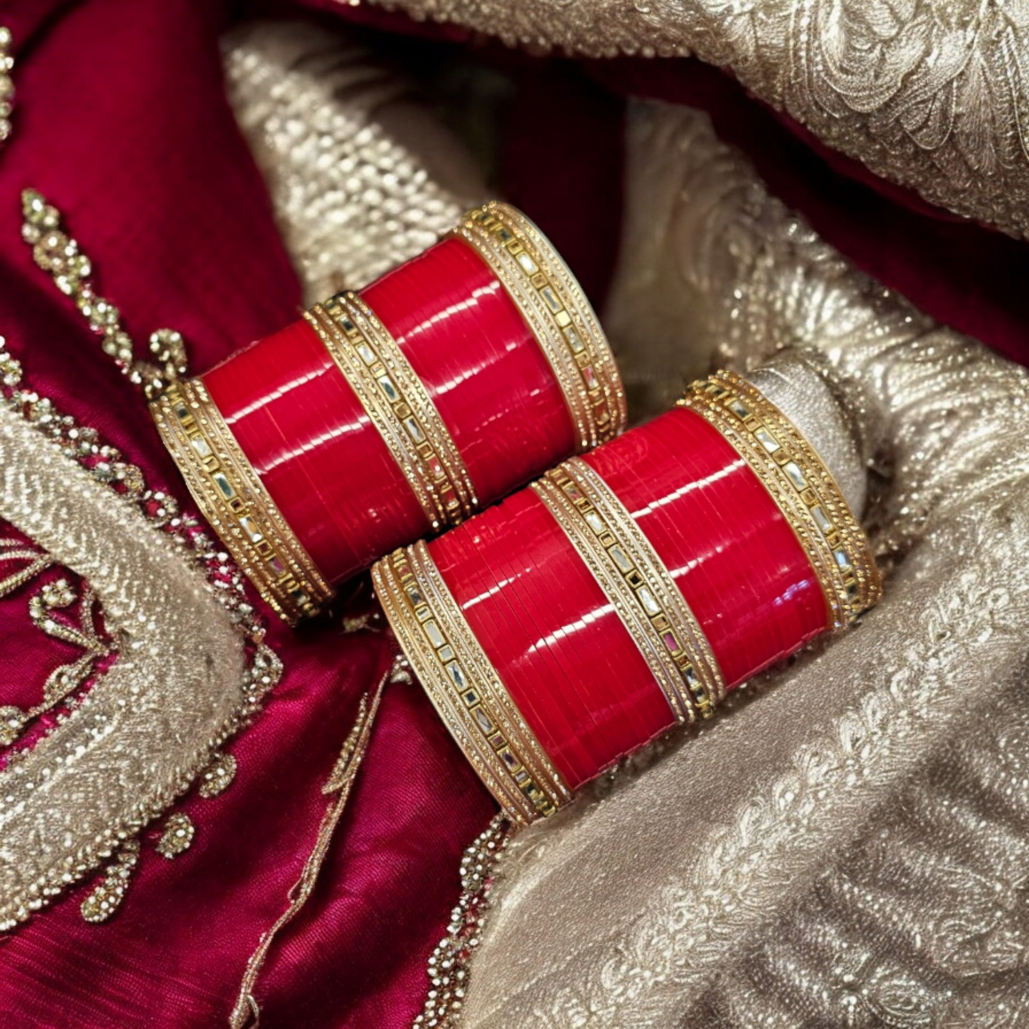 Designer Wedding Chura bangle set with Kundan work on an embroidered scarf as the background.