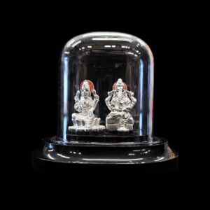 999 Pure Silver Lakshmi Ganesha Idol in acrylic dome, ideal for puja, gifting, or décor. Finely crafted with 99.9% pure silver & glitter finish.