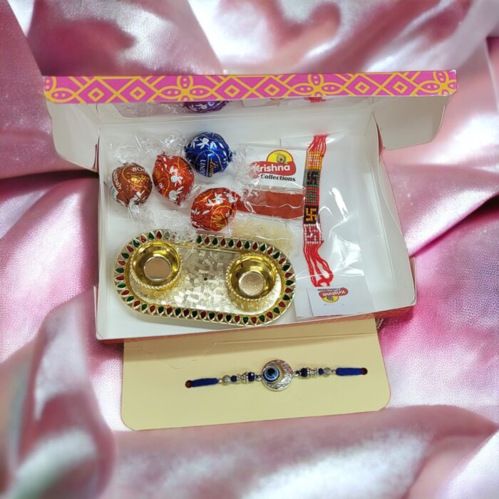 Evil eye Rakhi - Lindor Chocolate Rakhi Hamper . Send rakhi to Canada . Send Rakhi to USA