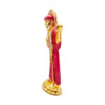 Buy Sai Baba car dashboard idol in Canada and US. Red Sai Baba idol on a white background with a side view.