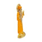 Buy Sai Baba car dashboard idol in Canada and US. Orange Sai Baba idol on a white background (side view).