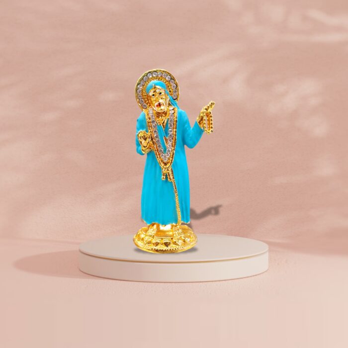 Buy Sai Baba car dashboard idol in Canada and US. Blue Sai Baba idol on a pink background.