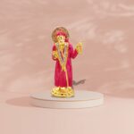 Buy Sai Baba car dashboard idol in Canada and US. Red Sai Baba idol on a pink background.