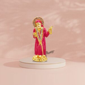 Buy Sai Baba car dashboard idol in Canada and US. Red Sai Baba idol on a pink background.