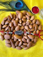 Om emblem rakhi with almonds hamper in Canada and the US