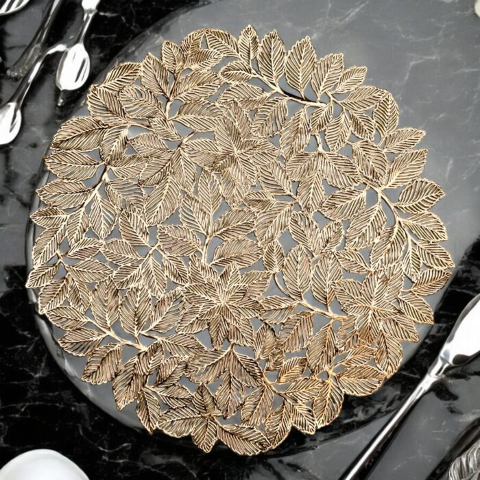 Image of a leaf shaped golden table mat. Perfect table mats for Diwali Decorations in Canada and the USA