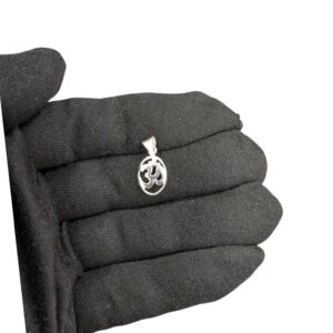 Real look and size of silver Om pendant on a adult hand