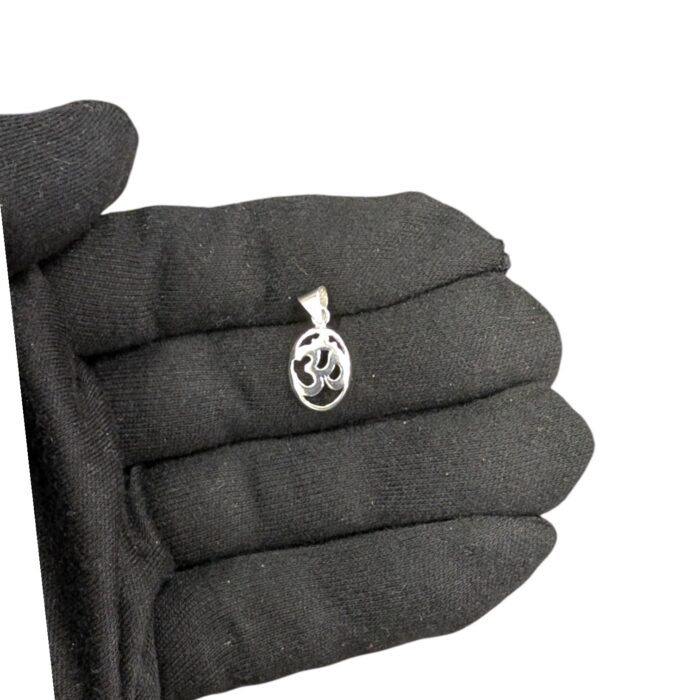 Real look and size of silver Om pendant on a adult hand