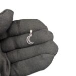 Real look of the silver moon pendant on a adult hand