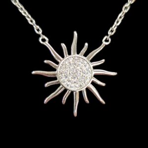 Close up view of the sterling silver sun shaped pendant
