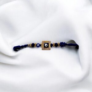 Sparkling blue evil eye rakhi with cubic zirconia stones for brother