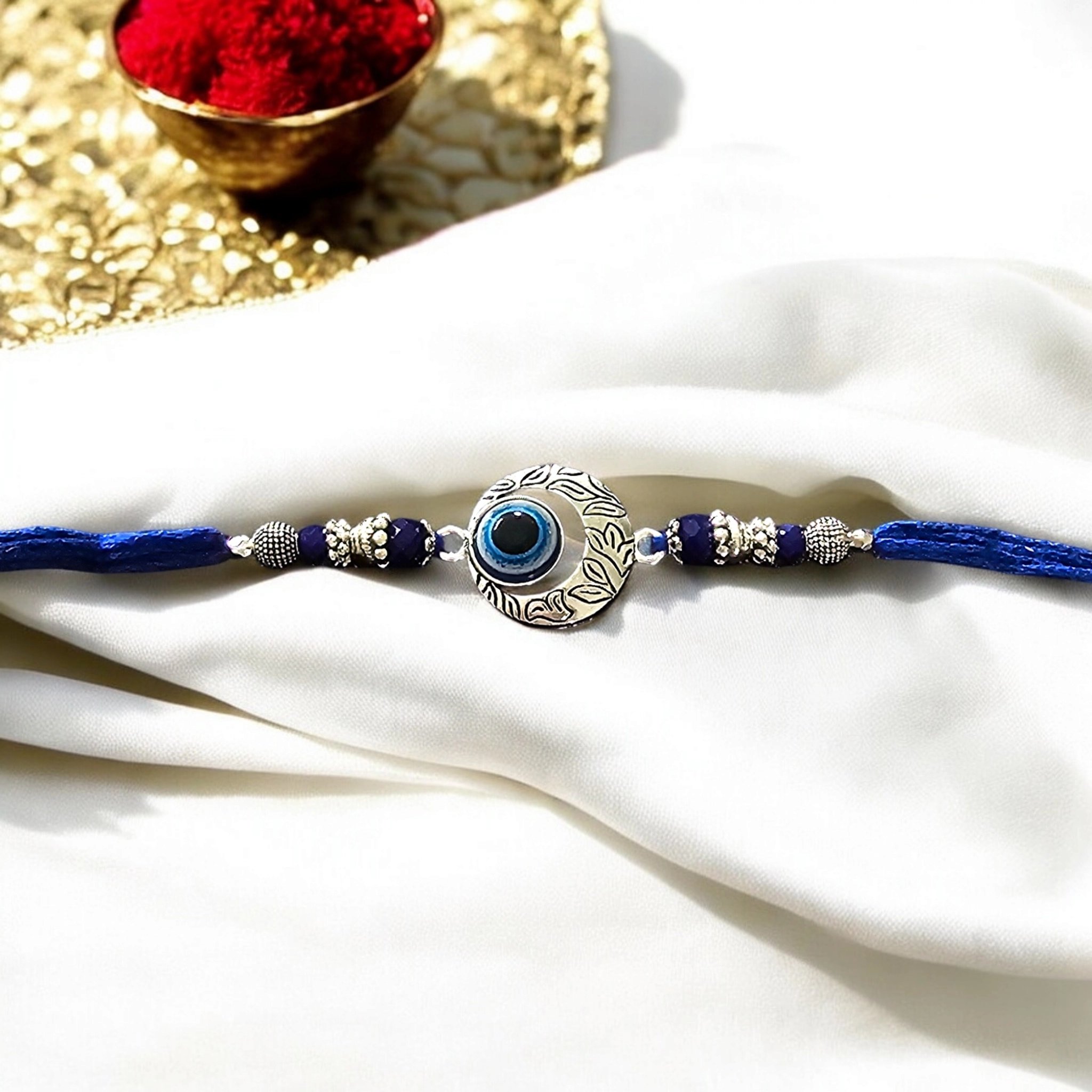 Evil eye Rakhi - Silver moon | Evil eye Rakhi Evil eye Rakhi - Silver moon | Evil eye Rakhi