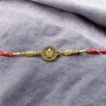 Close up of Rakhi with Ganesh emblem | Thoughtful rakhi gift
