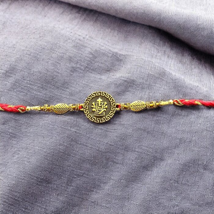 Close up of Rakhi with Ganesh emblem | Thoughtful rakhi gift