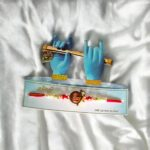 Beautiful packaging for this rakhi with Shri Krishna emblem