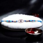 Pure Silver Evil Eye Rakhi for Brother with blue stones and sterling silver band - Customizable Gift