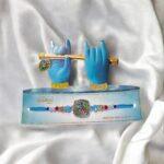 Beautiful packaging for this rakhi with krishna emblem