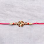 Elegant Bhai Rakhi with matching bhabhi rakhi