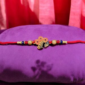 Elegant Bhai Rakhi with matching bhabhi rakhi