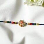 Elegant Bhai Rakhi with matching bhabhi lumba rakhi